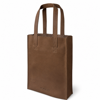 Brown paper bag with handles on a white background