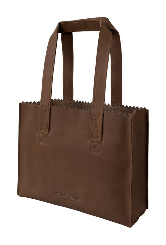 Brown paper bag with handles on a white background