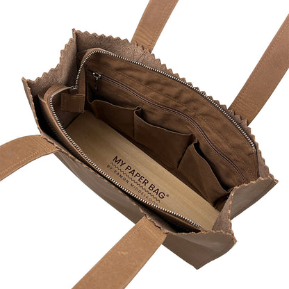 Brown paper bag with visible branding on a white background
