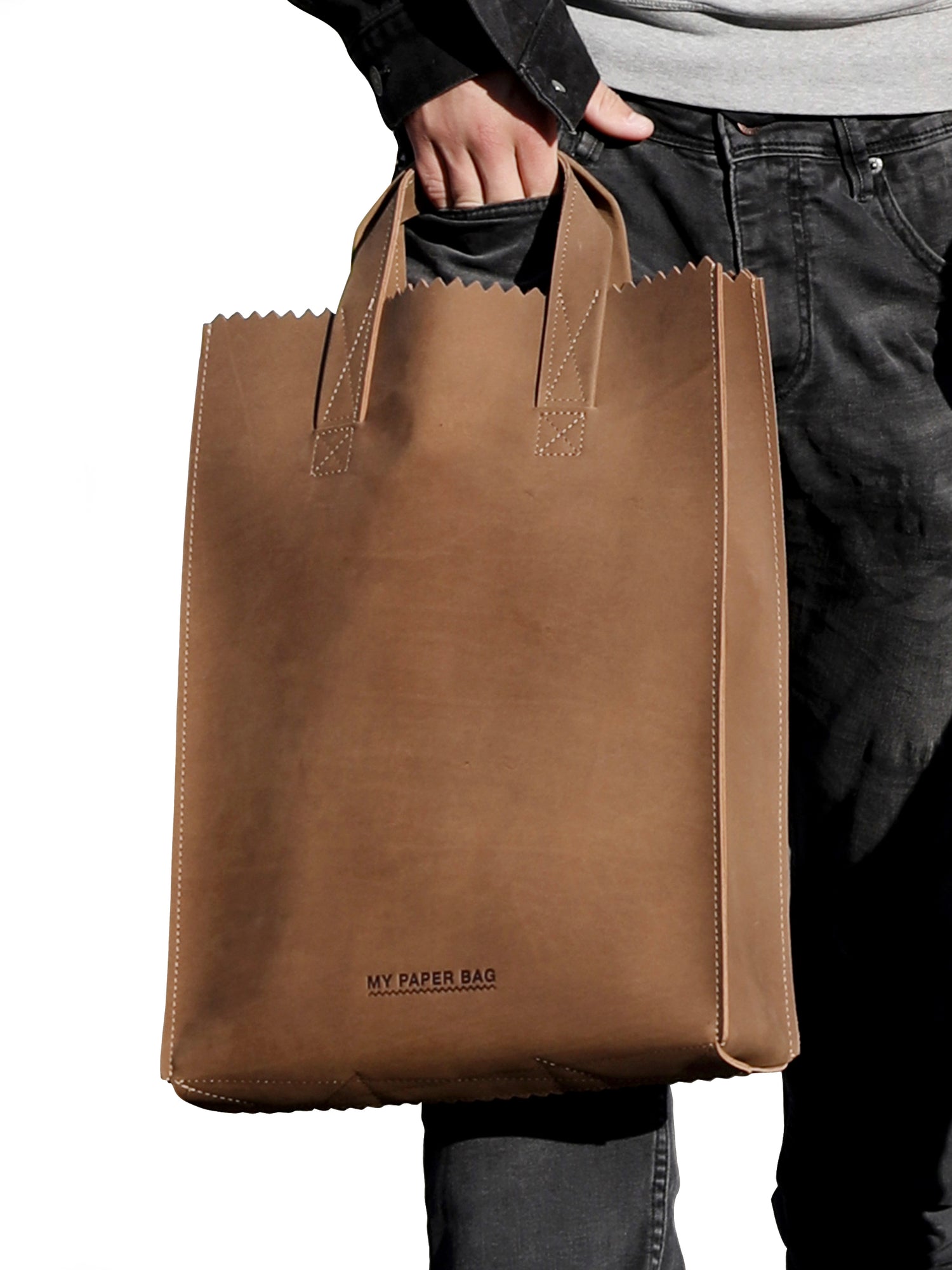 Brown paper bag held by a person with 'My Paper Bag' branding.