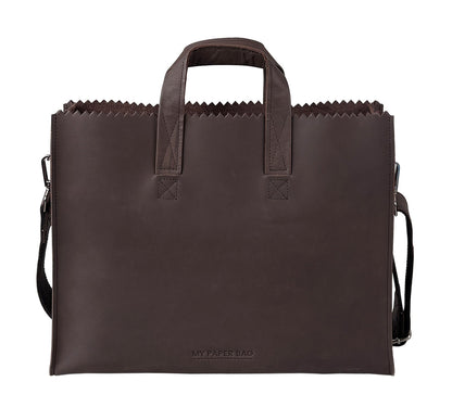 Brown paper bag with handles and a strap on a white background